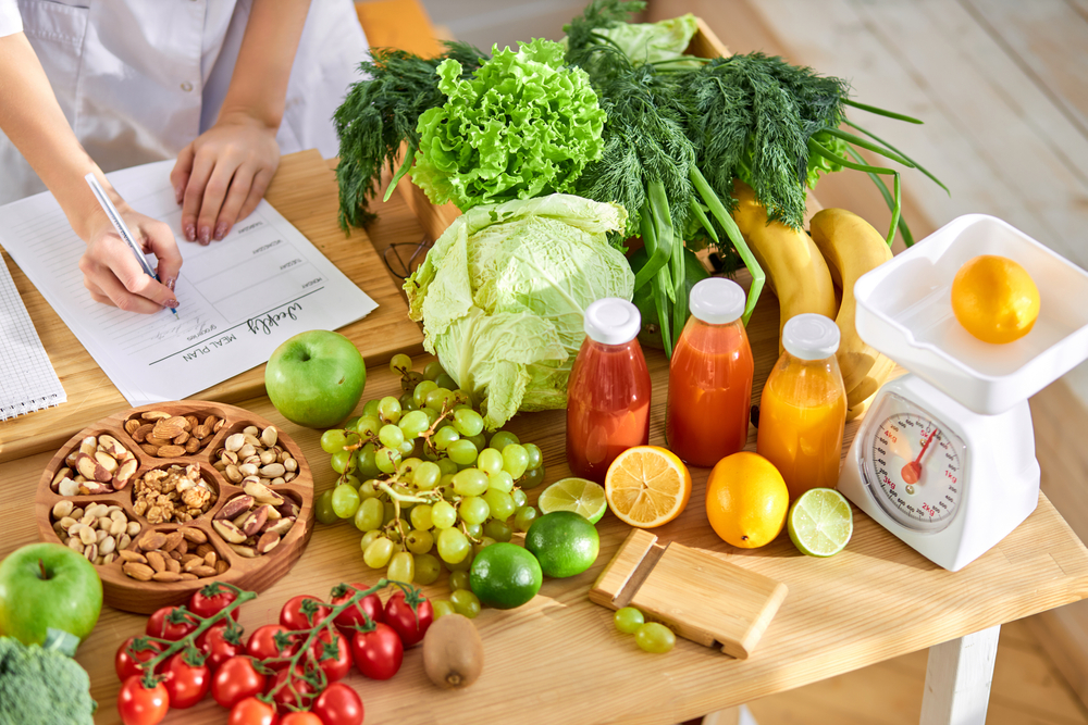 A person taking notes of the food they would like to eat for Nutrition